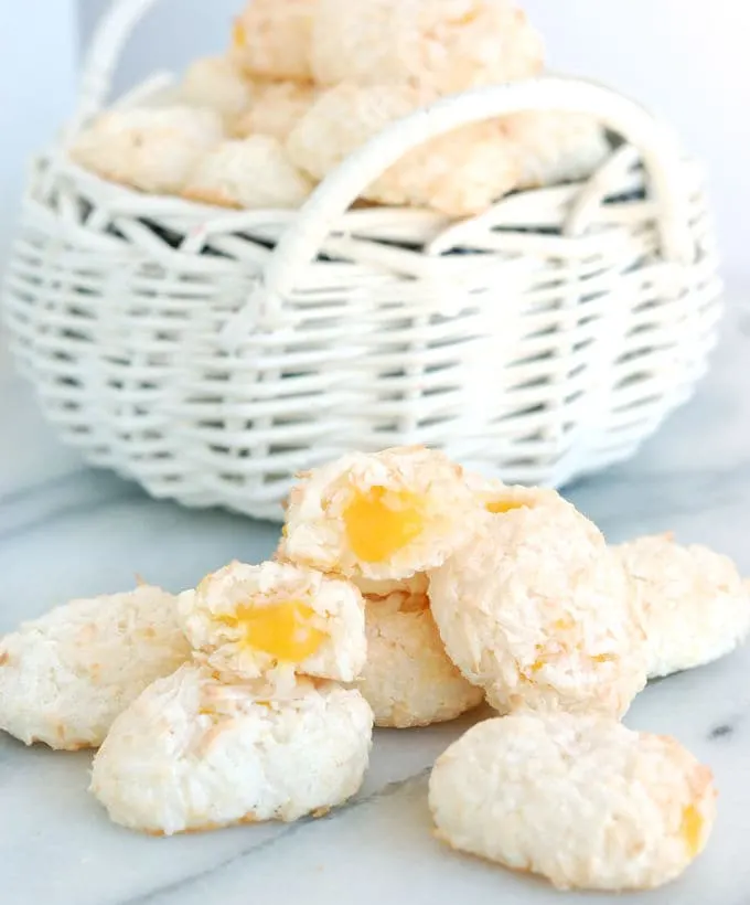 a basket of coconut macaroon easter eggs with a passion fruit yolk