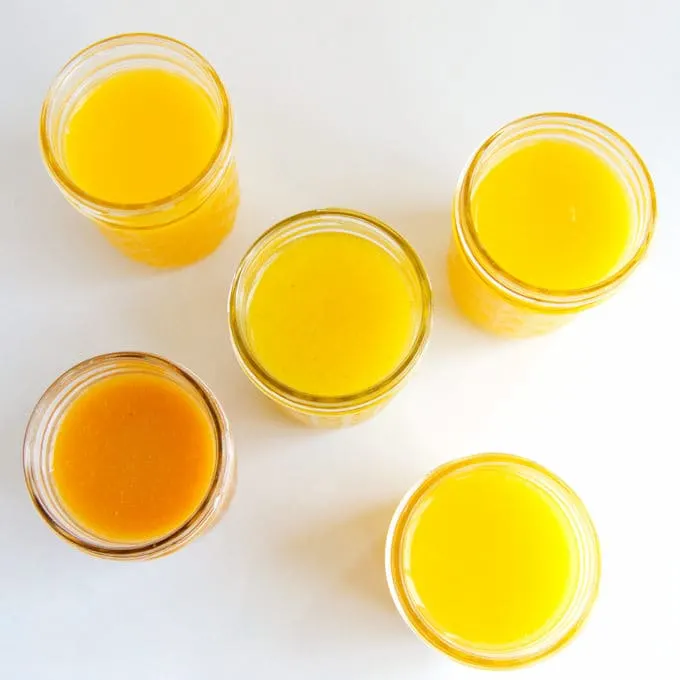 passion fruit curd and  other fruit curds in jars, top view