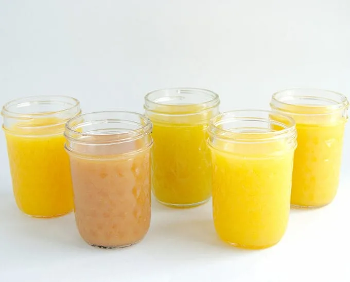 passion fruit curd, guava curd, pineapple curd and mango curd in jars