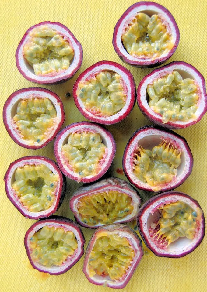 sliced passion fruit on a yellow background