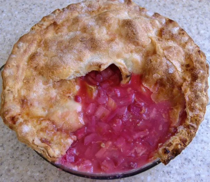 a pie with a slice cut and running filling spilling out