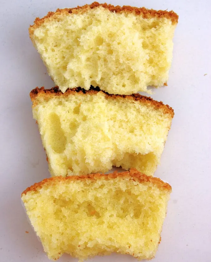 Three pieces of vanilla cake on a white background. Each cake has a different texture.