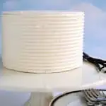 a white cake on a white cake stand