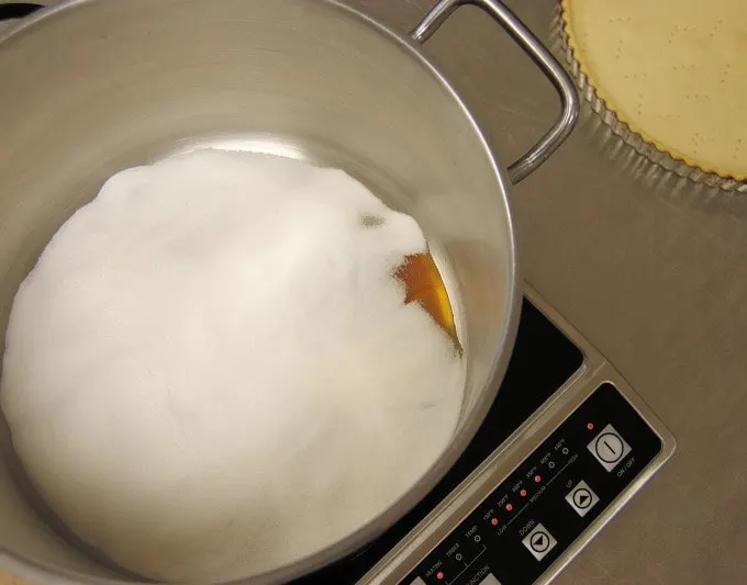 a pot filled with caramelizing sugar