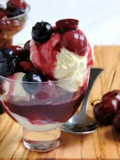 a bowl of Cheesecake Ice Cream with blueberry and cherry compote