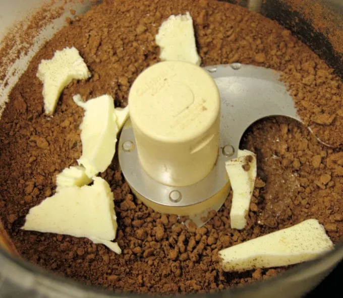 Place the chopped chocolate, butter and corn syrup into the food processor or into a mixing bowl.