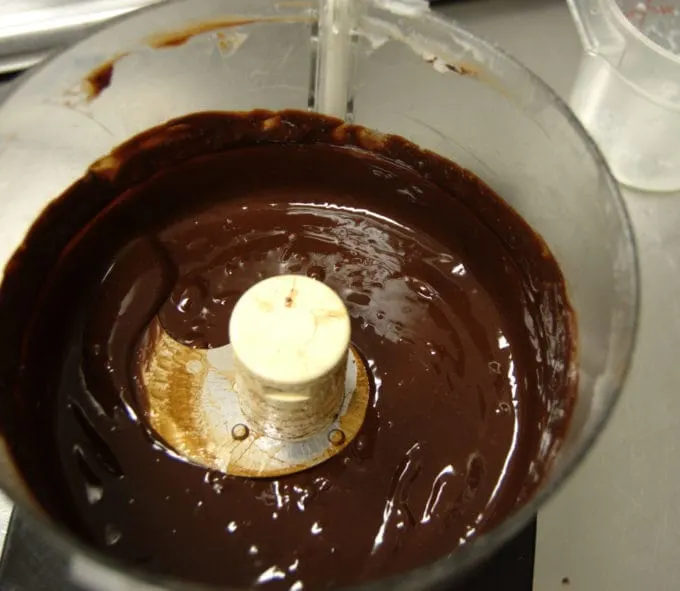 Using a food processor is quick and easy but will create air bubbles to the ganache.