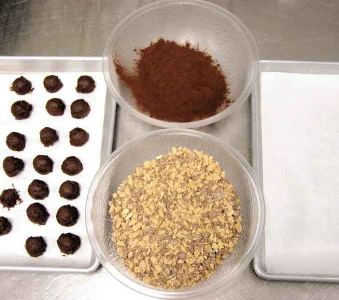 Once the truffles are scooped, set up your assemly line with the coatings and a clean tray for the finished candies.