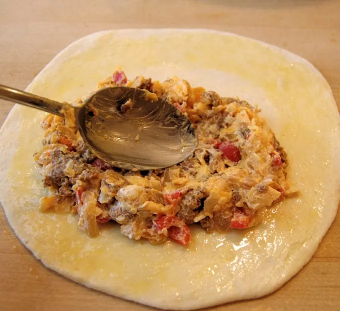 assembling a breakfast calzone