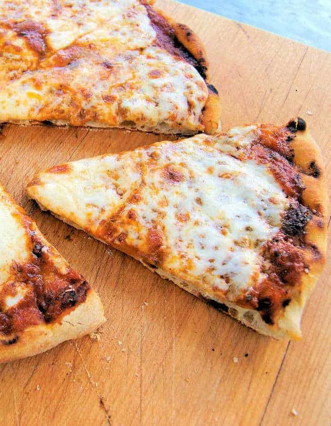 a slice of pizza on a cutting board