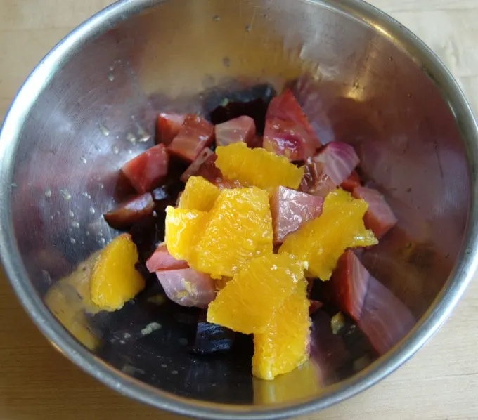 Combine the chopped roasted beets with the orange segments and juice. Toss gently to avoid breaking up the orange segments