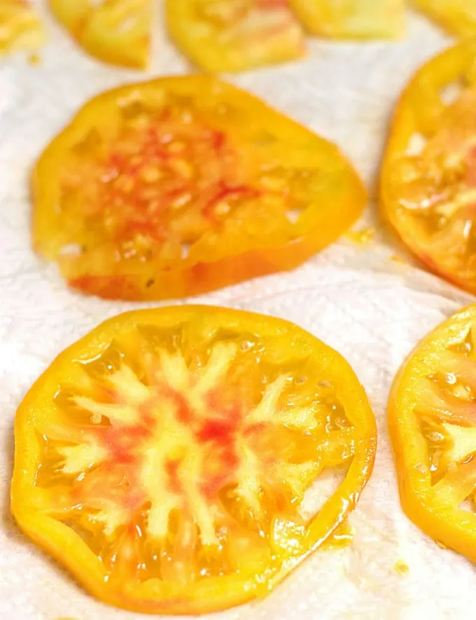 slices of heirloom tomatoes on a paper towel