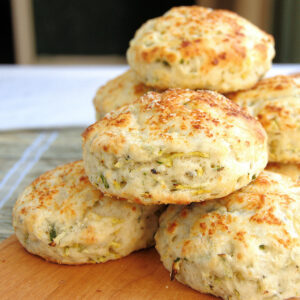 a stack of zucchini biscuits on a cutting board