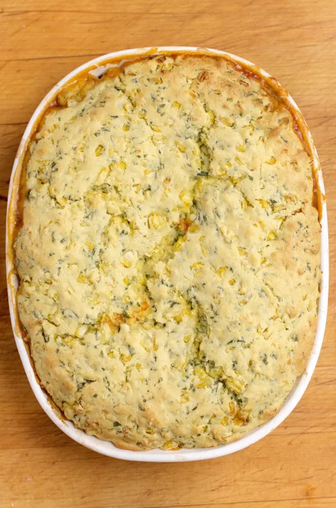 freshly baked tomato cobbler on a table
