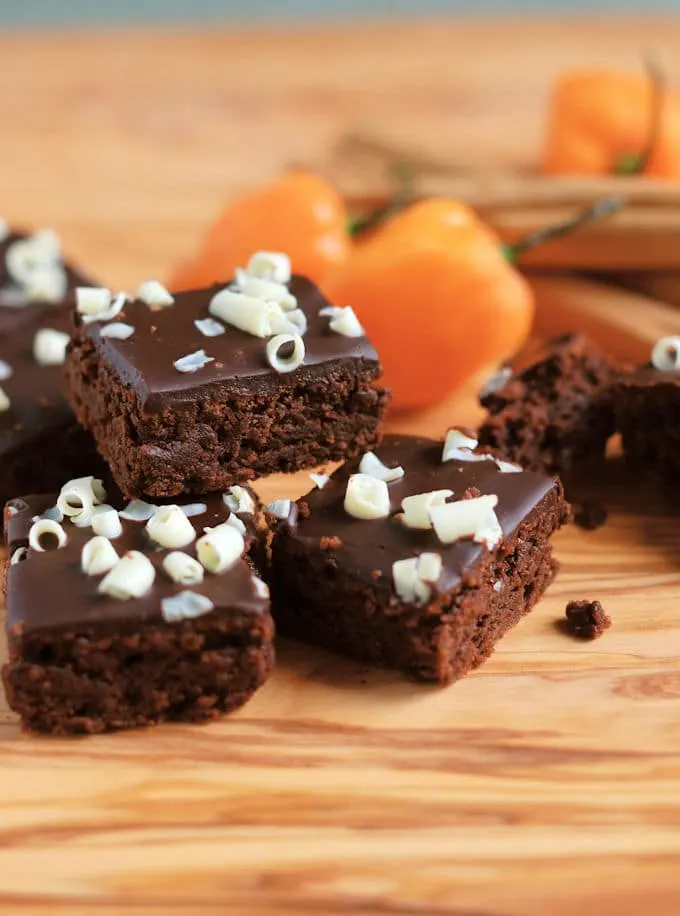 three habanero brownies on a wood surface