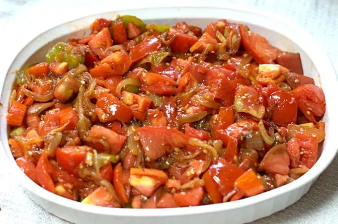 tomato cobbler filling in a casserole dish