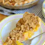 a pinterest image for peach crumb pie