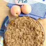 a pinterest image for peach crumb pie