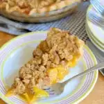 a slice of peach almond crumb pie