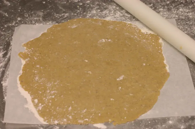 rolling dough on parchment paper