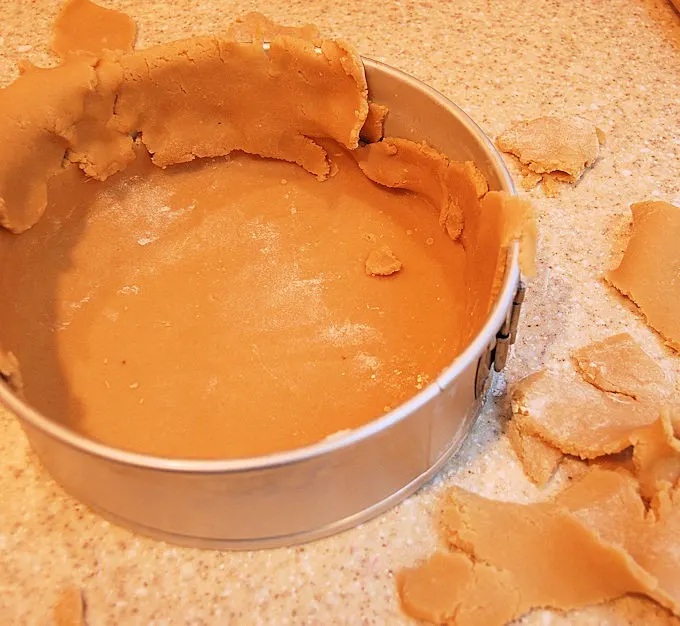 lining a tart pan with crumbly dough