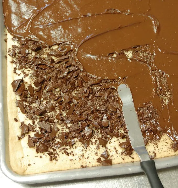 spreading chocolate on shortbread