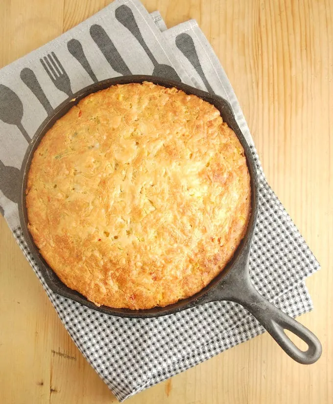 cast iron skillet mexican cornbread on a kitchen towel