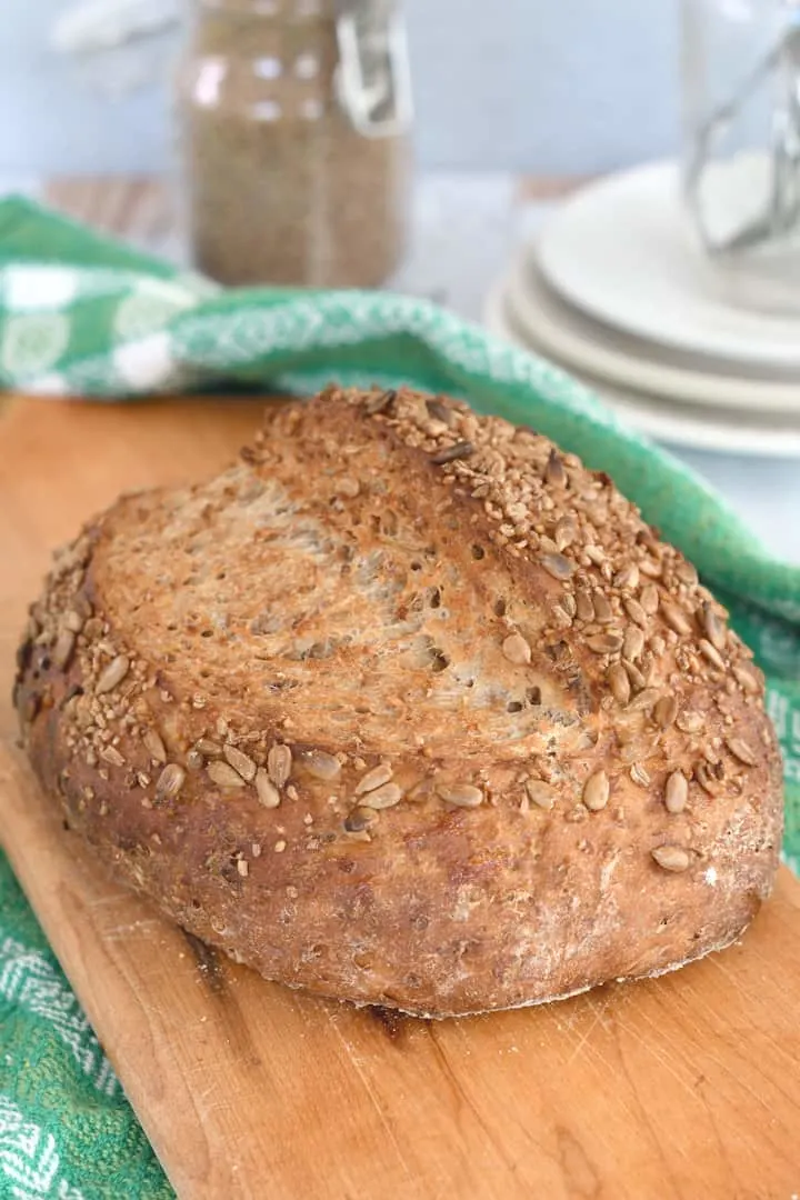 a loaf of bulgur wheat bread on a cutting board