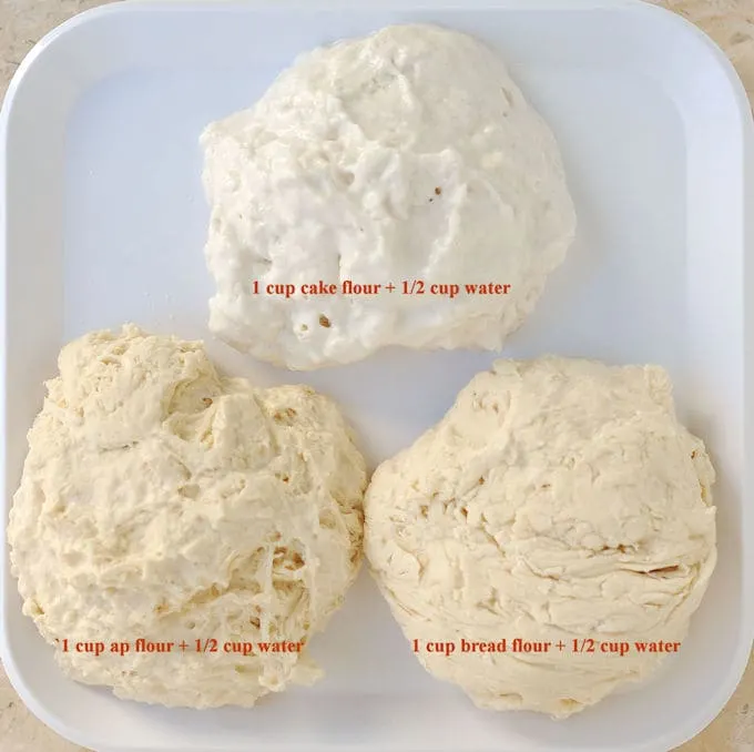Three pieces of flour and water dough arranged on a white plate to show how in cake batter, flour is important.