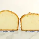 two pound cakes sitting side by side on marble surface with a white background