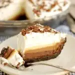 a slice of triple chocolate pie on a plate