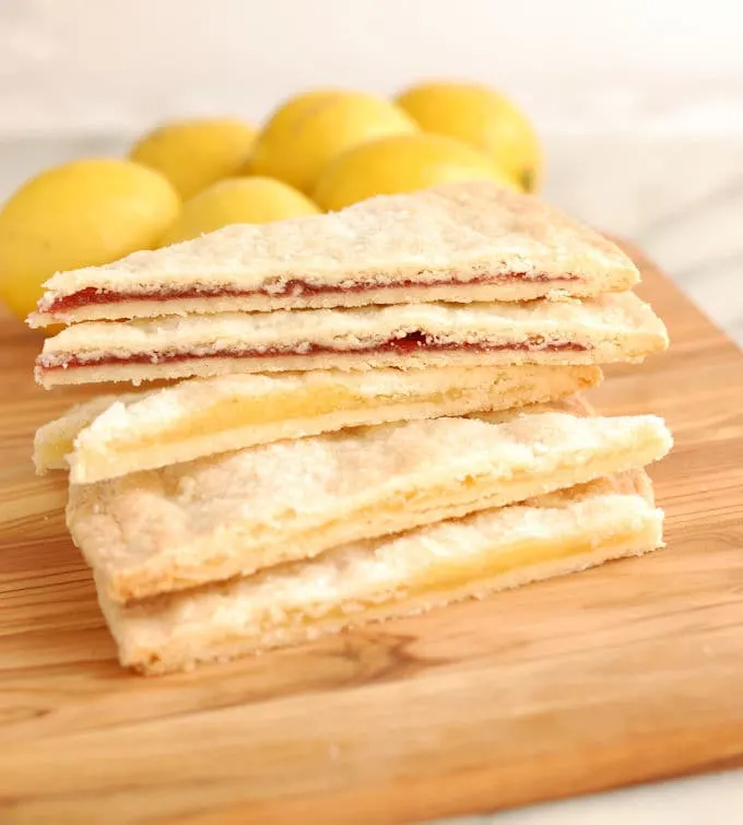 filled shortbread wedges on a cutting board