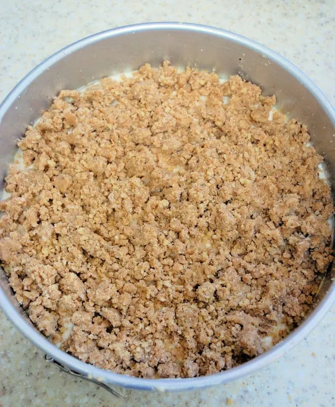 crumb topping on a banana coffeecake ready for the oven