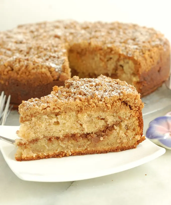 a slice of banana coffeecake on a white plate