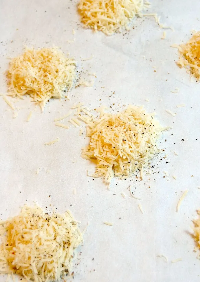 shredded parmesan cheese on a tray ready for the oven.