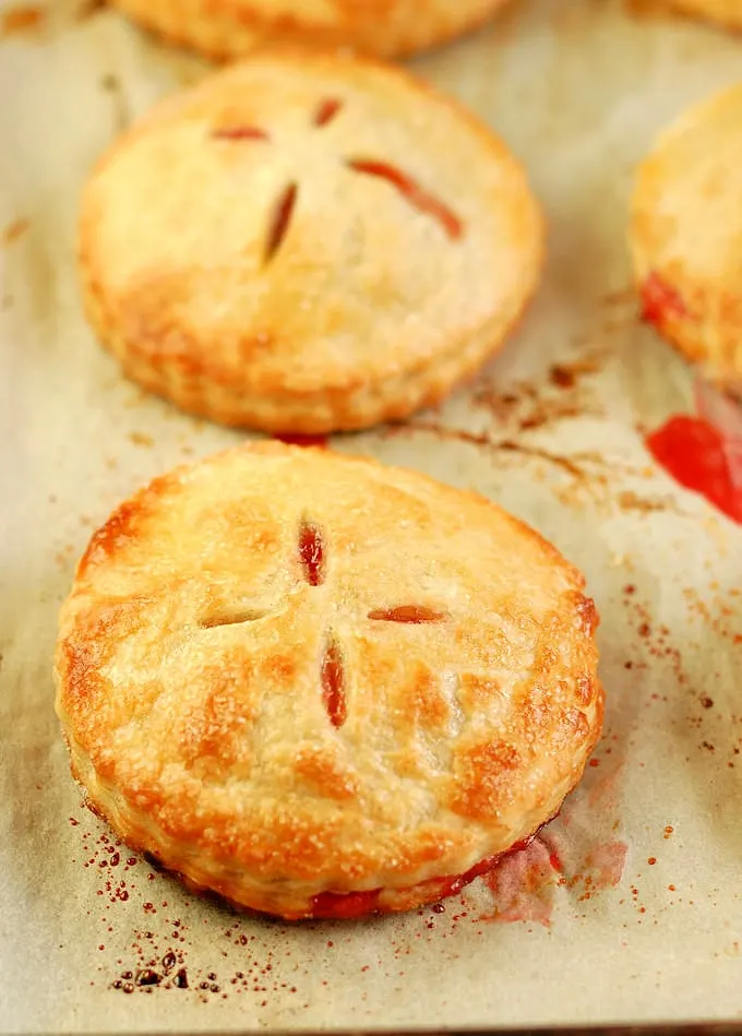 freshly baked strawberry hand pies on a tray