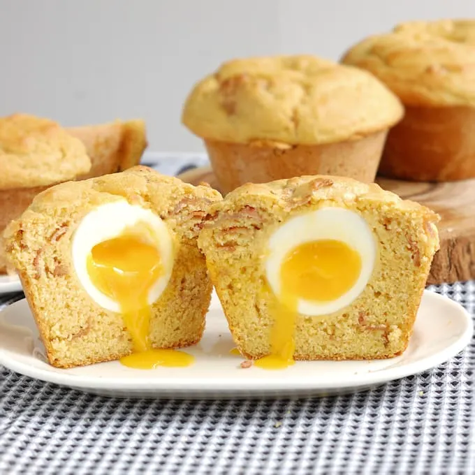 Slightly sweet corn muffins with a surprise runny egg inside - bacon & egg (in a) muffin.