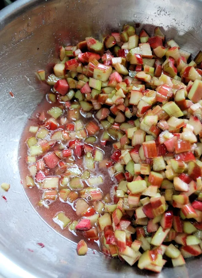 a bowl of macerating rhubarb cubes