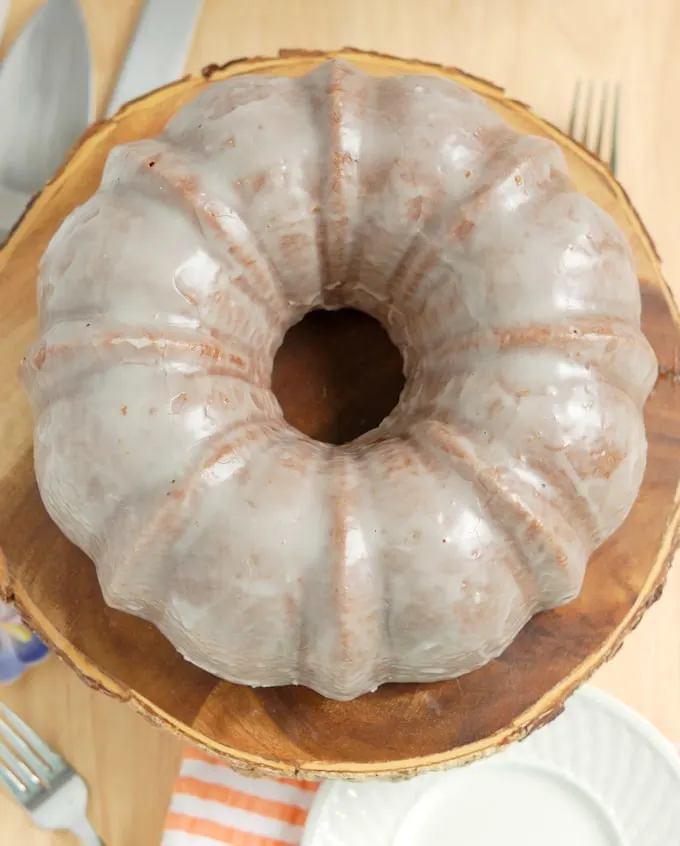 buttermilk bundt cake with buttermilk glaze on a cake stand top view