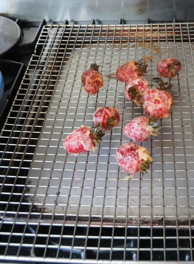 tempura strawberries on a cooling rack