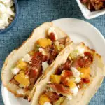 a pinterest image for pulled pork tacos with grilled peach salsa with text overlay