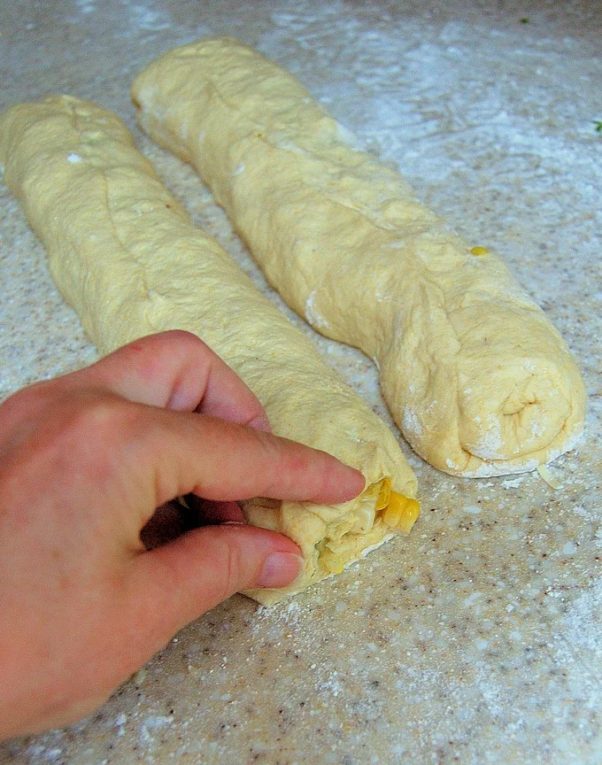 forming sourdough cornbread into a twist