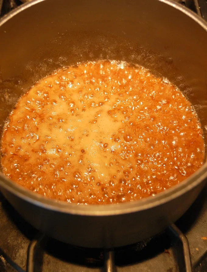 peach caramel boiling in a pot