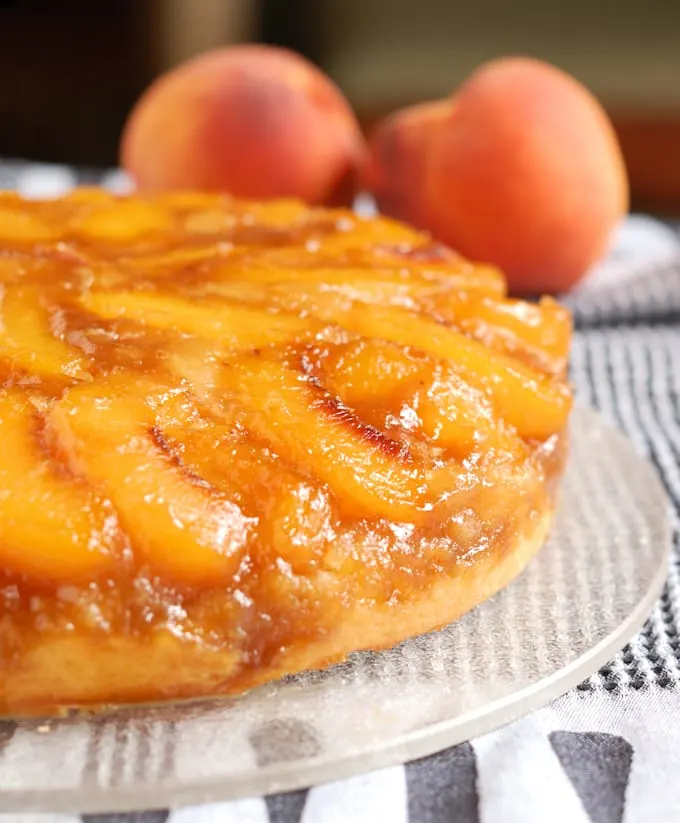 a closeup of a peach upside down cake