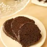 three slices of chocolate cake on a white plate