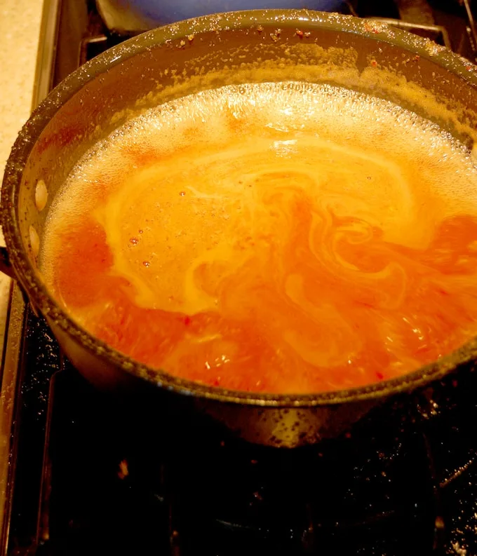 a pot full of preserves, boiling