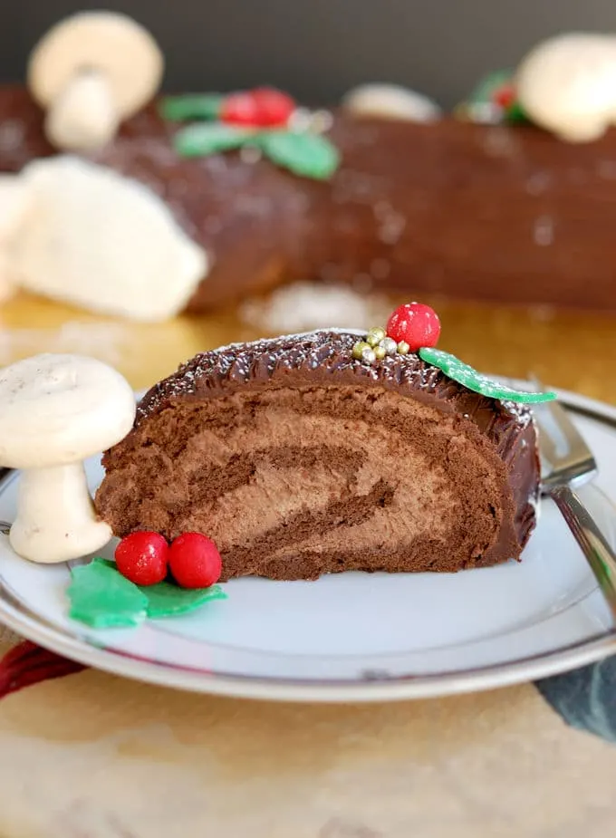 a slice of chocolate Buche de Noel, Yule Log Cake