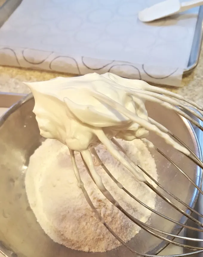 whipped egg whites on a whisk