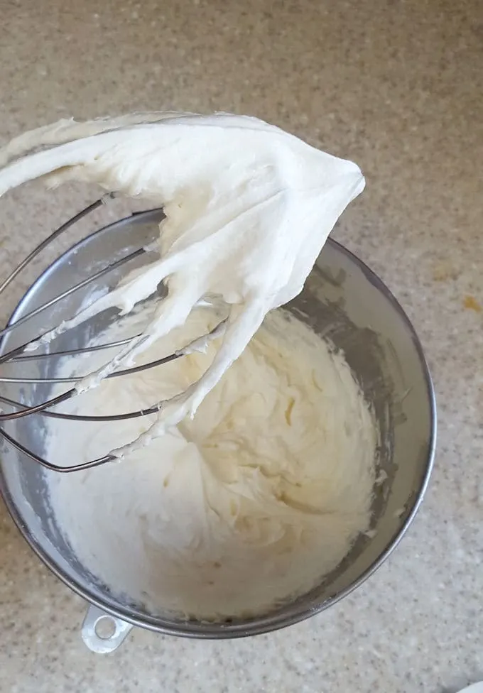 whipped cream frosting on a whisk