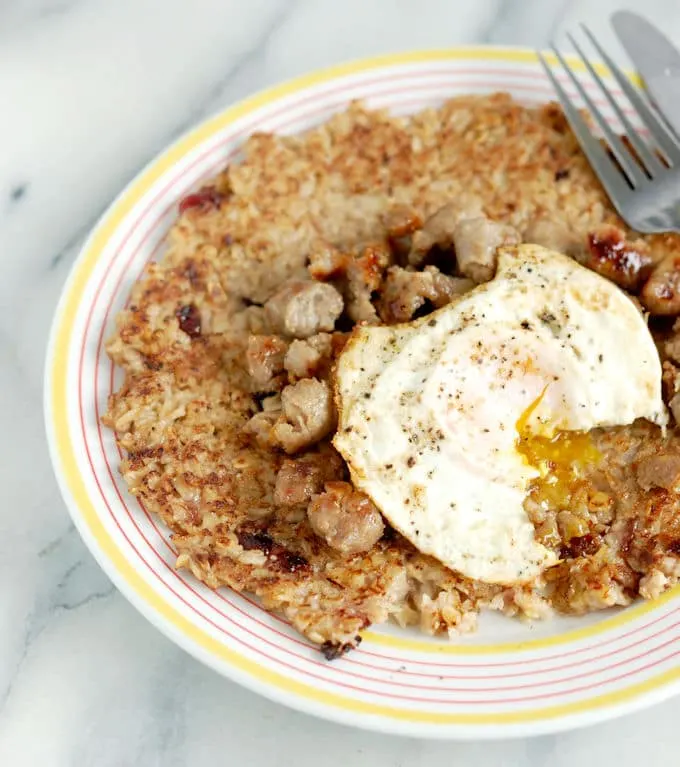 a Crispy Oatmeal Pancake Topped with Sausage & Egg